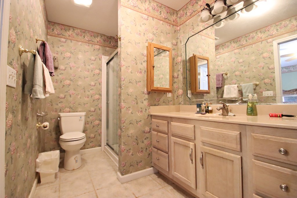 154 Charleston Road Cookeville, TN 38506 - Photo 13 of 23 a bathroom with a double vanity sink toilet and a shower