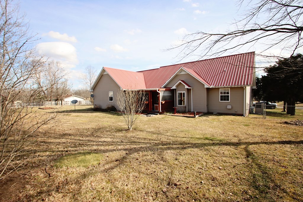 154 Charleston Road Cookeville, TN 38506 - Photo 20 of 23 a front view of a house with a yard