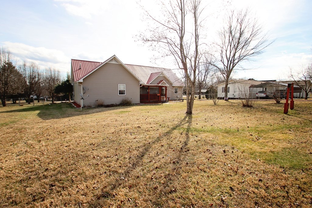 154 Charleston Road Cookeville, TN 38506 - Photo 21 of 23 a view of a yard with a large tree in front of it