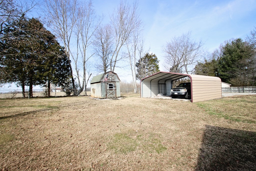 154 Charleston Road Cookeville, TN 38506 - Photo 22 of 23 a front view of a house with a yard and garage