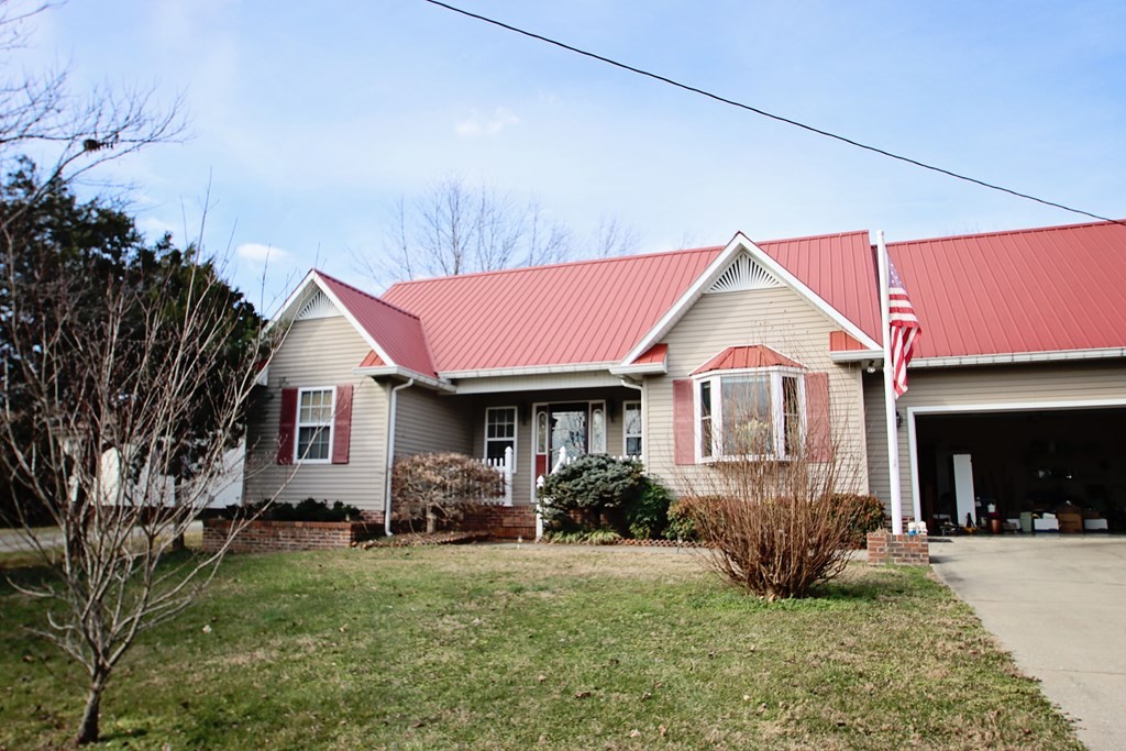154 Charleston Road Cookeville, TN 38506 - Photo 3 of 23 a front view of a house with a yard and garage