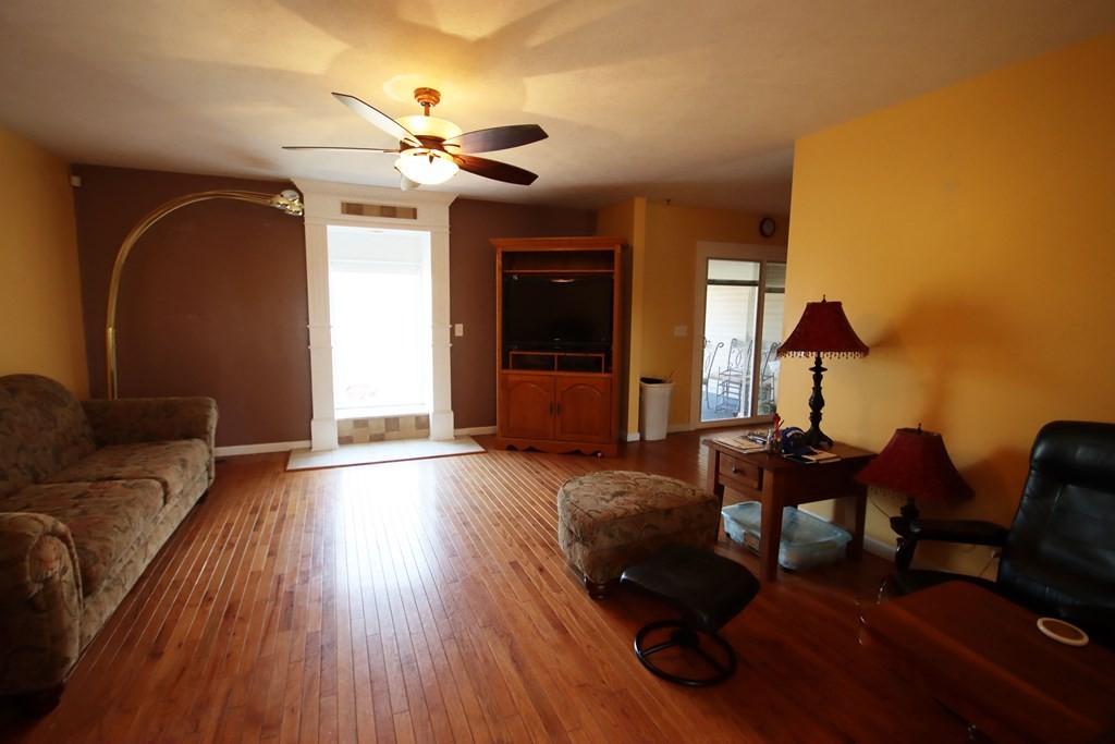 154 Charleston Road Cookeville, TN 38506 - Photo 7 of 23 a living room with furniture and a wooden floor