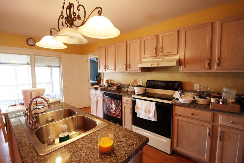 154 Charleston Road Cookeville, TN 38506 - Photo 10 of 23 a kitchen with stainless steel appliances granite countertop a sink stove and cabinets