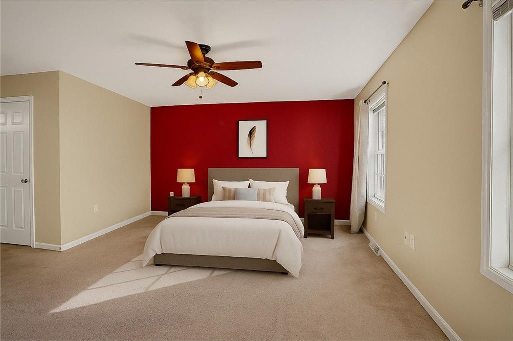 90 Coffeys Crossing Road Washington, PA 15301 - Photo 12 of 50 a bedroom with a bed and a chandelier