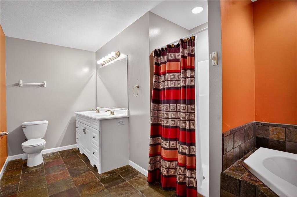 90 Coffeys Crossing Road Washington, PA 15301 - Photo 15 of 50 a bathroom with a toilet and a shower