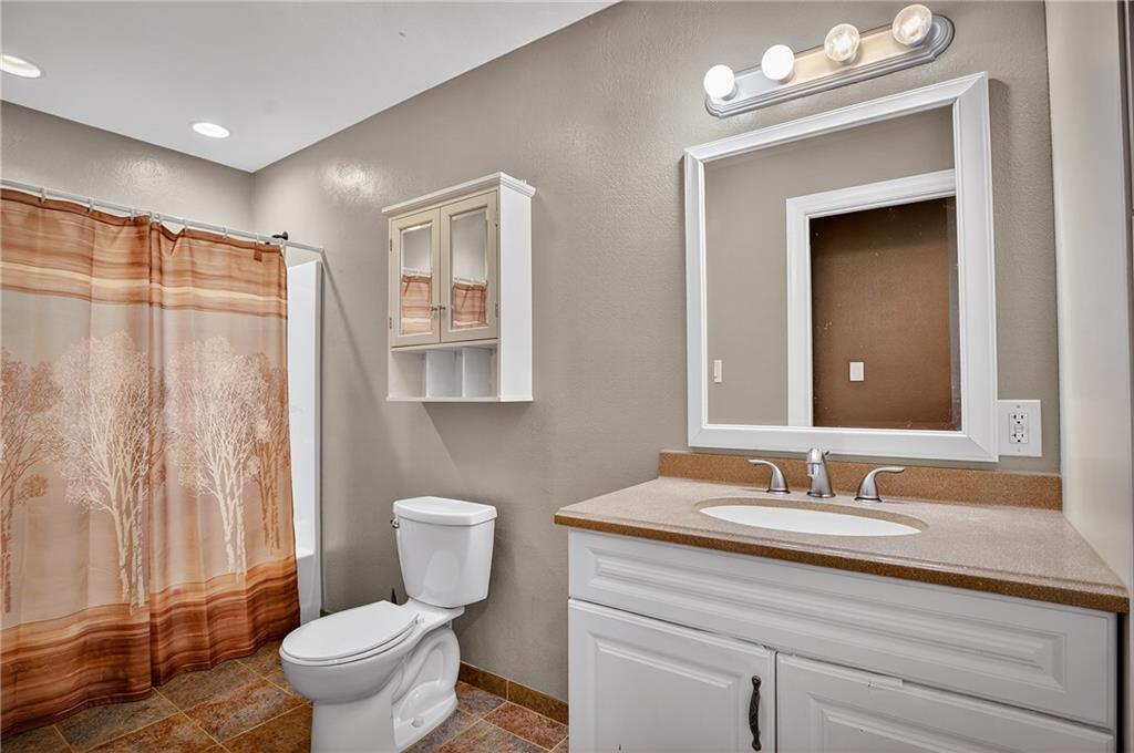 90 Coffeys Crossing Road Washington, PA 15301 - Photo 19 of 50 a bathroom with a granite countertop shower sink vanity mirror and toilet