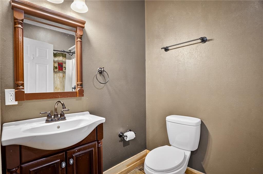 90 Coffeys Crossing Road Washington, PA 15301 - Photo 25 of 50 a bathroom with a toilet a sink and mirror