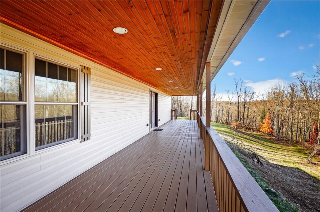 90 Coffeys Crossing Road Washington, PA 15301 - Photo 29 of 50 a view of a balcony with wooden floor and fence and a floor to ceiling window