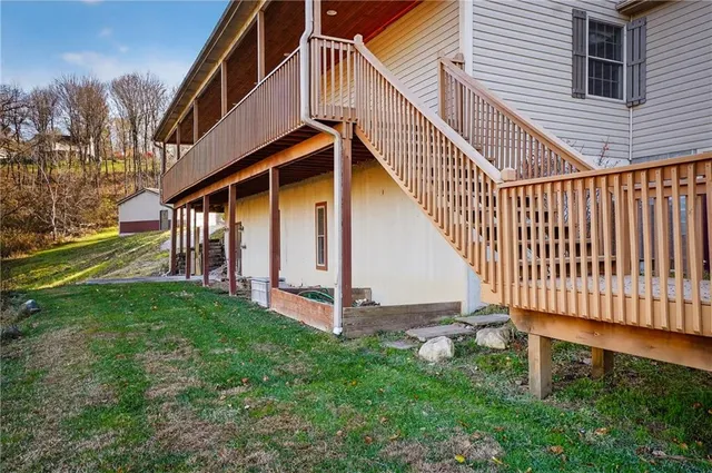 a backyard of a house with lots of green space