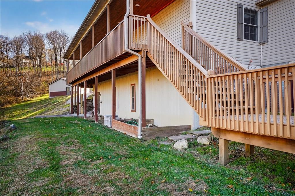 90 Coffeys Crossing Road Washington, PA 15301 - Photo 35 of 50 a view of a house with a yard and deck
