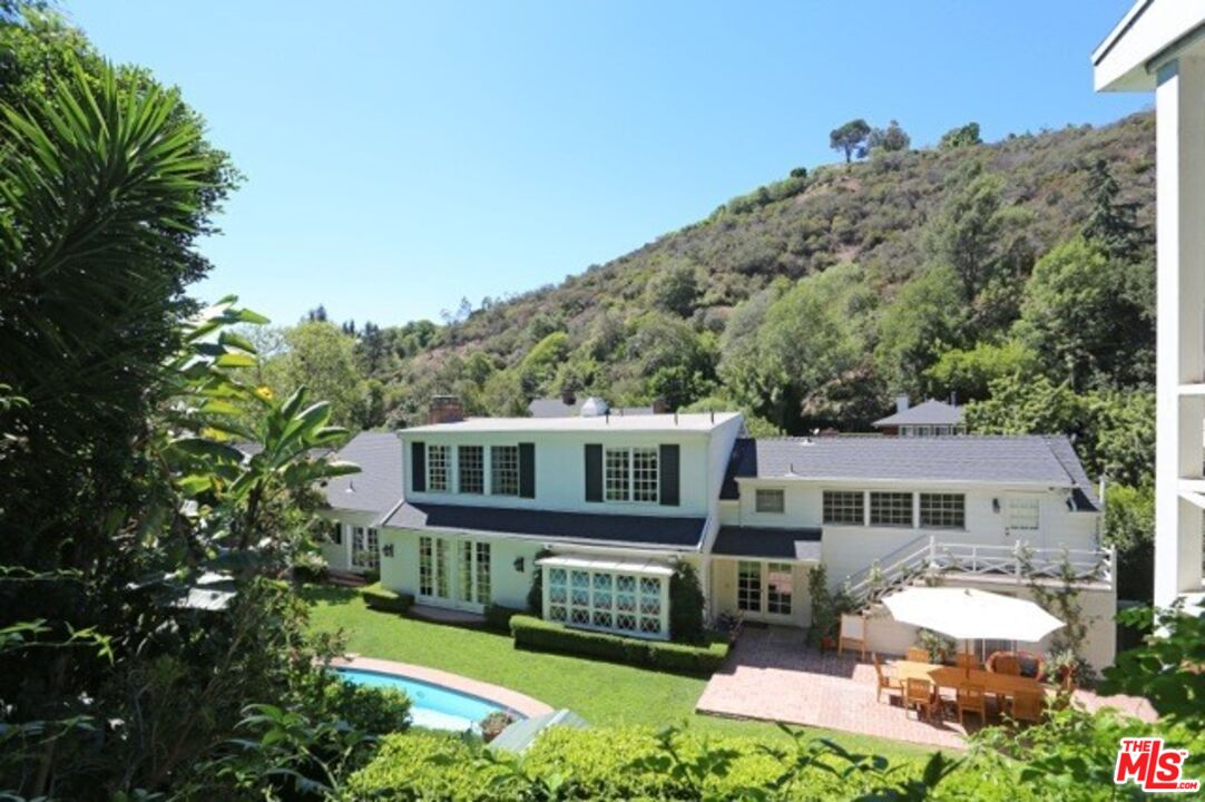 914 Chantilly Road Los Angeles, CA 90077 - Photo 1 of 25 a aerial view of a house with a yard balcony and outdoor seating