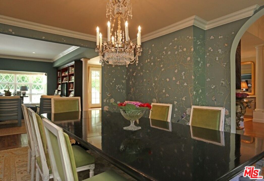 914 Chantilly Road Los Angeles, CA 90077 - Photo 13 of 25 a view of a dining room with furniture a chandelier and large windows