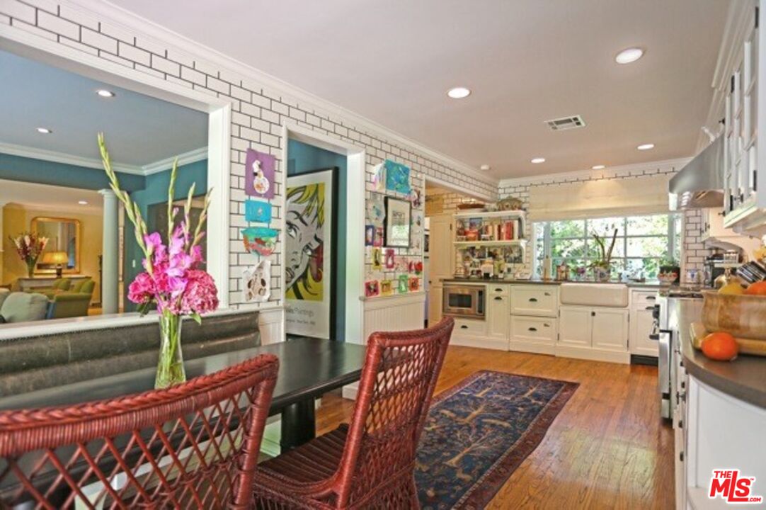 914 Chantilly Road Los Angeles, CA 90077 - Photo 18 of 25 a living room with furniture and a floor to ceiling window