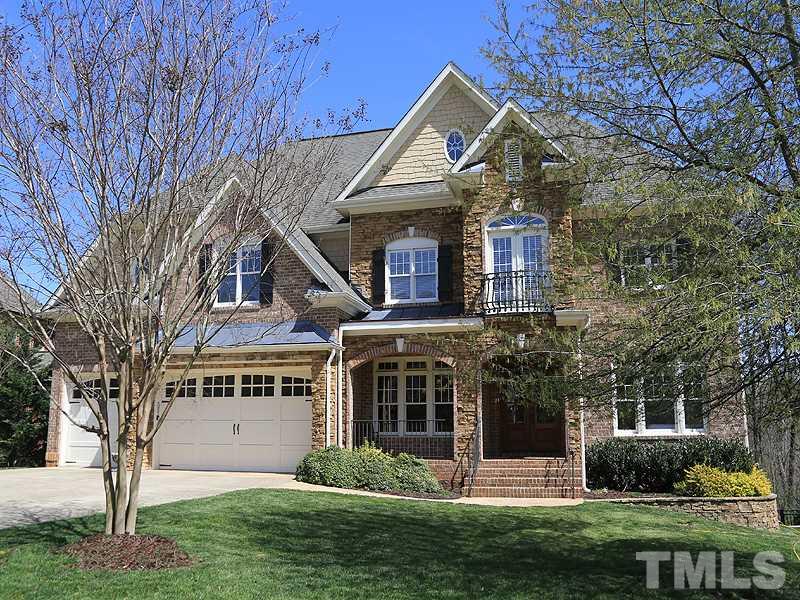 5214 Landguard Drive Raleigh, NC 27613 - Photo 1 of 20 a front view of a house with a garden and plants