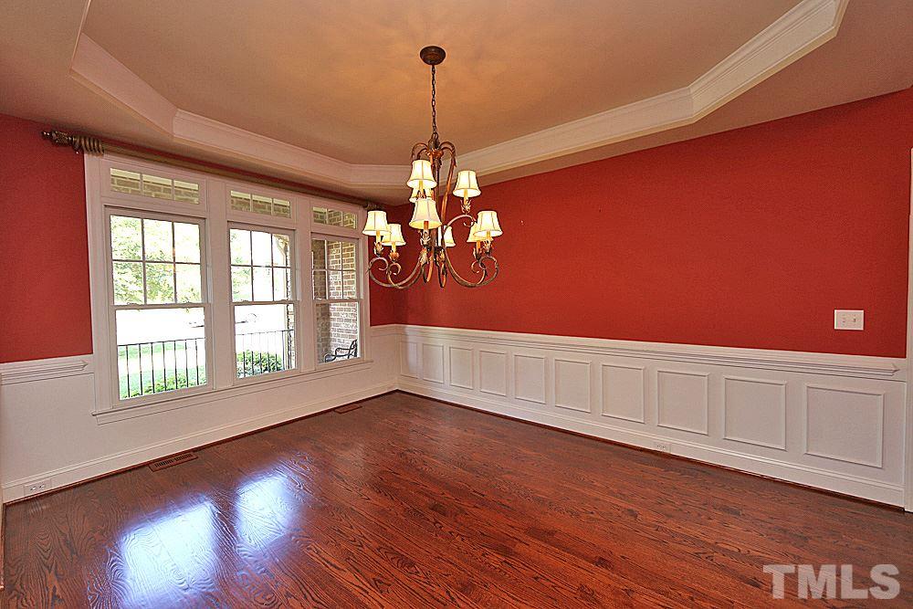 5214 Landguard Drive Raleigh, NC 27613 - Photo 9 of 20 a view of a room with wooden floor and fan