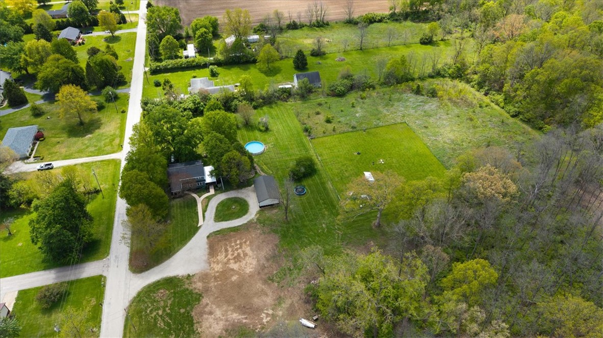 5120 Wheelock Road Troy, OH 45373 - Photo 63 of 67 Expansive property with lush green space, a winding driveway, and natural surroundings.