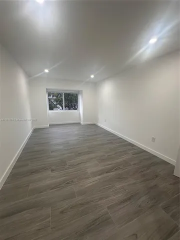 a living room with wooden floor