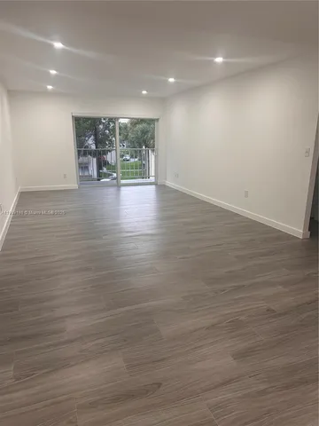 a view of room and wooden floor