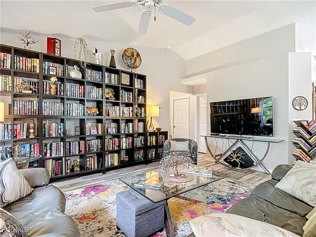 a living room with furniture or couch and a flat screen tv