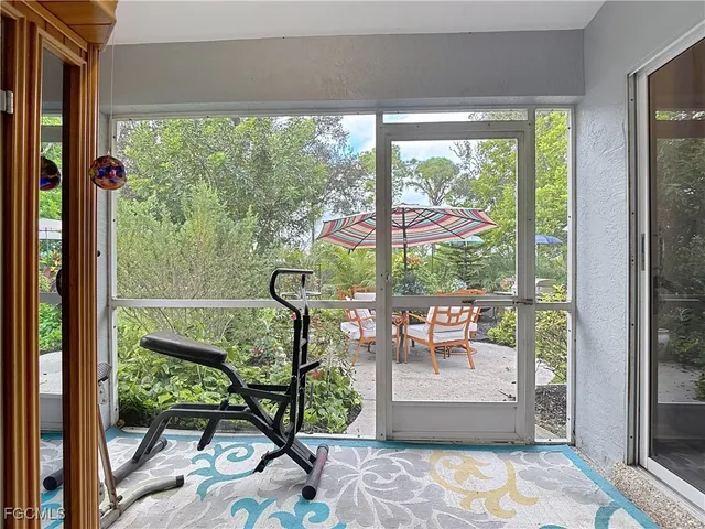 a view of a living room and floor to ceiling window