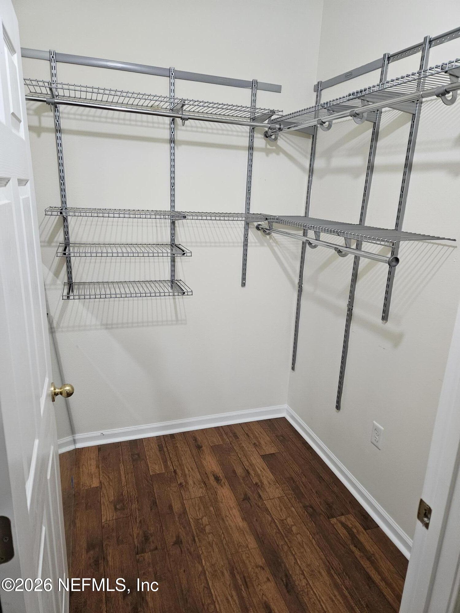 8218 Green Parrot Road, Unit 308 Jacksonville, FL 32256 - Photo 15 of 25 a view of a room with racks on the wall