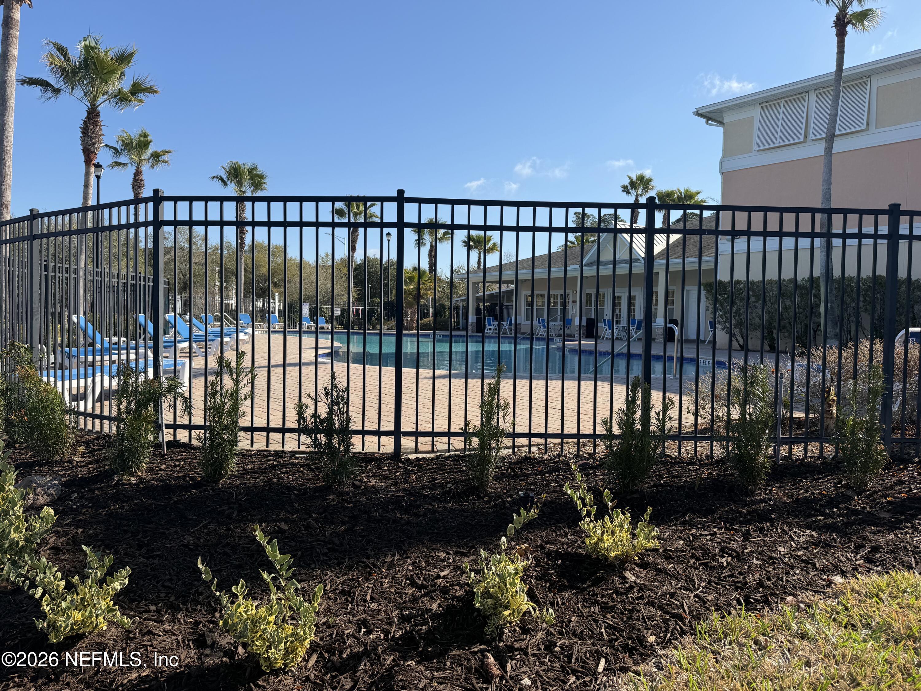 8218 Green Parrot Road, Unit 308 Jacksonville, FL 32256 - Photo 24 of 25 a view of a balcony with a garden