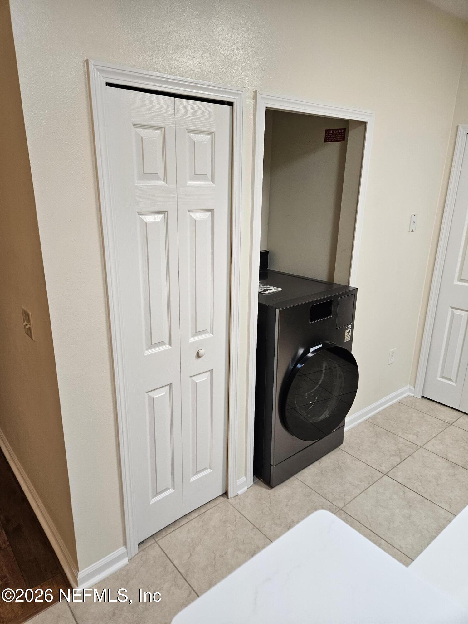 8218 Green Parrot Road, Unit 308 Jacksonville, FL 32256 - Photo 25 of 25 a view of a closet and a utility room