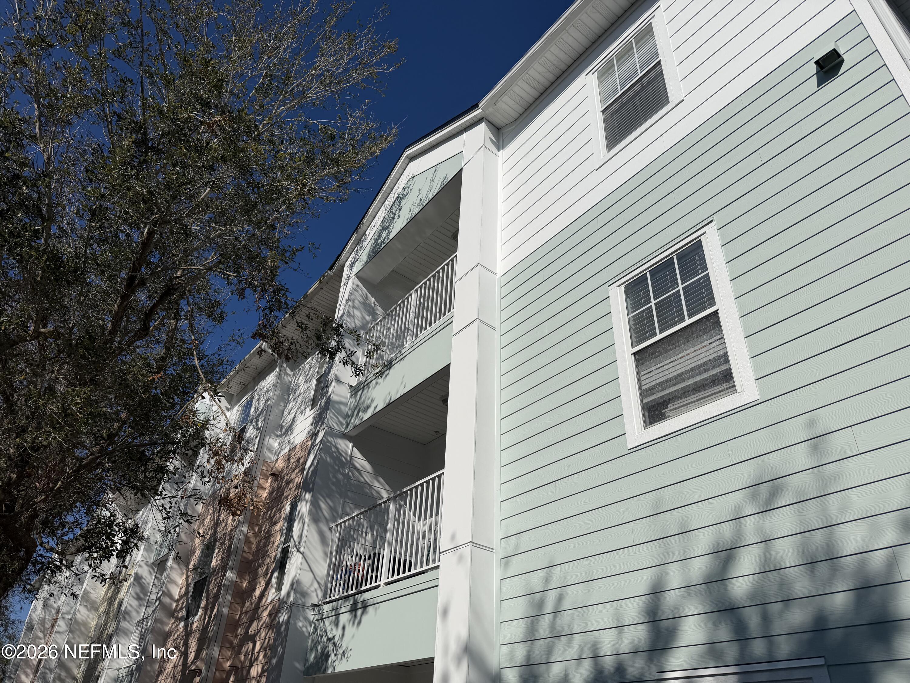 8218 Green Parrot Road, Unit 308 Jacksonville, FL 32256 - Photo 7 of 25 a view of a house with a tree