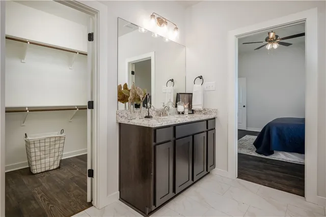 a en suite bathroom with a sink and a mirror