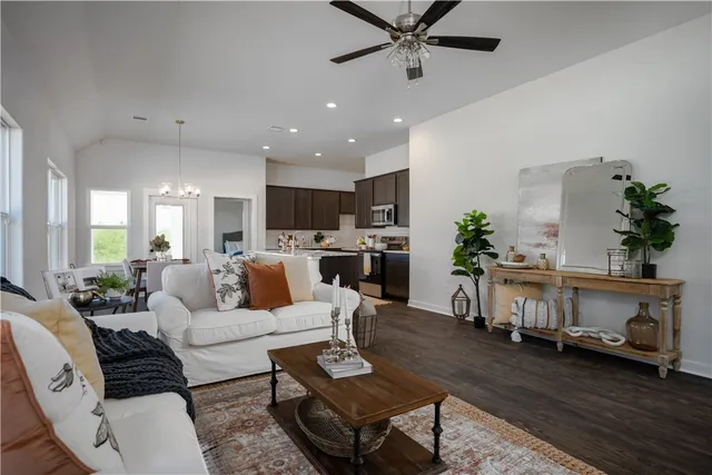 a living room with furniture and a fireplace