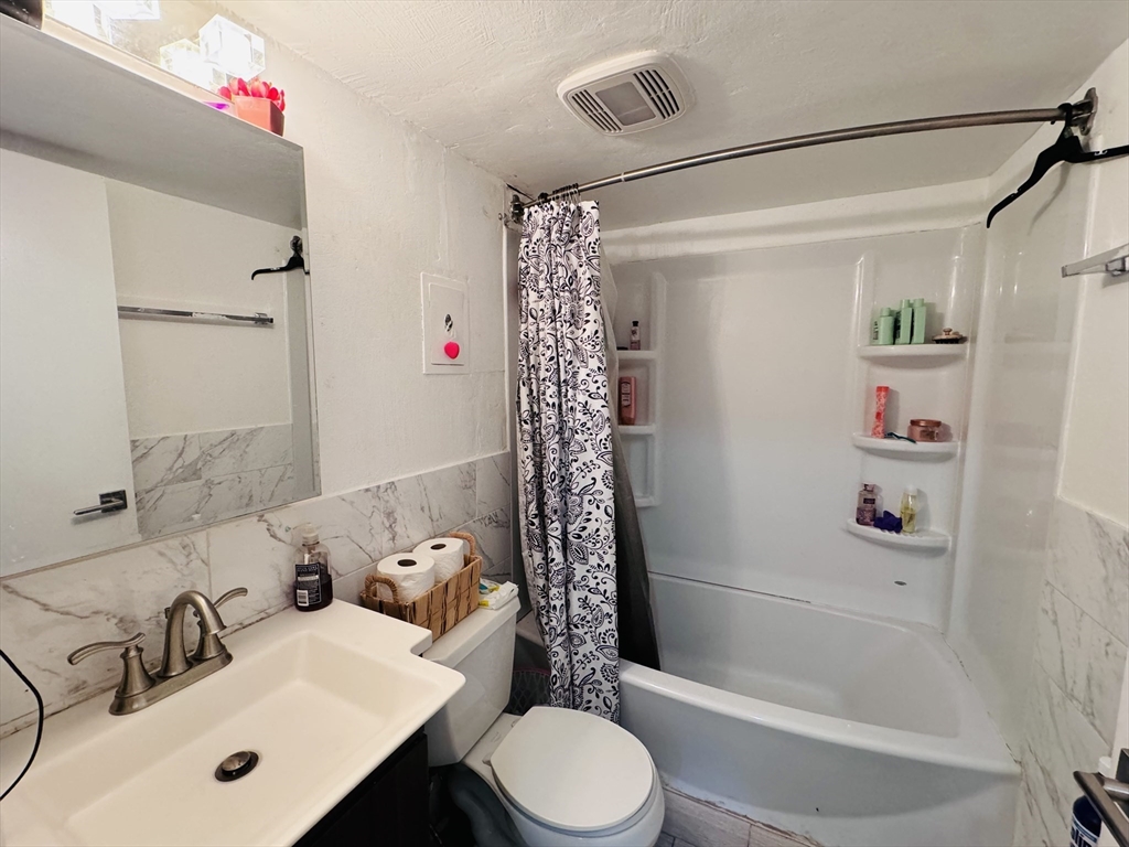 1323 Worcester Road, Unit H2 Framingham, MA 01701 - Photo 12 of 16 a bathroom with a sink toilet and shower
