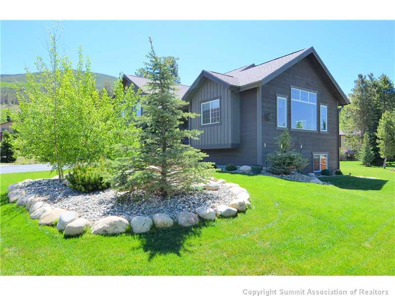 414 Big Elk Road Dillon, CO 80435 - Photo 1 of 25 a front view of a house with garden