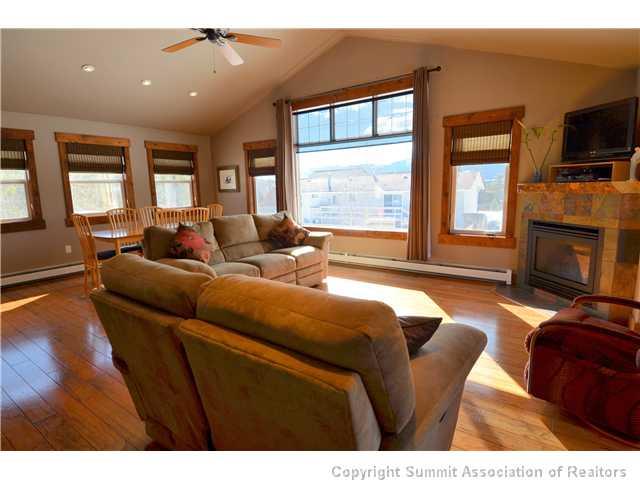 414 Big Elk Road Dillon, CO 80435 - Photo 14 of 25 a living room with furniture a flat screen tv and a fireplace