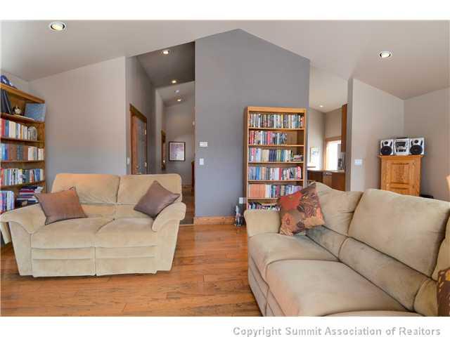 414 Big Elk Road Dillon, CO 80435 - Photo 15 of 25 a living room with furniture and a book shelf