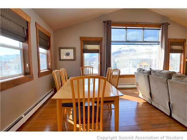414 Big Elk Road Dillon, CO 80435 - Photo 17 of 25 a view of a dining room with furniture window and wooden floor