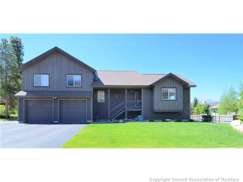414 Big Elk Road Dillon, CO 80435 - Photo 24 of 25 a front view of a house with a yard and garage