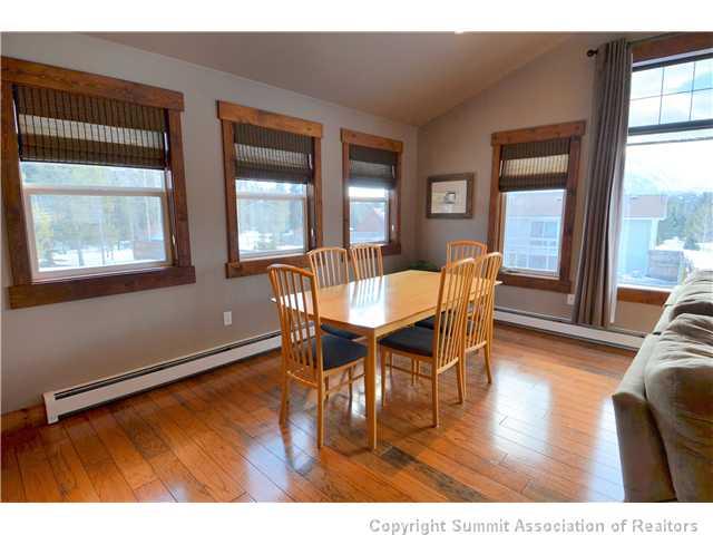 414 Big Elk Road Dillon, CO 80435 - Photo 4 of 25 a view of a dining room with furniture window and wooden floor