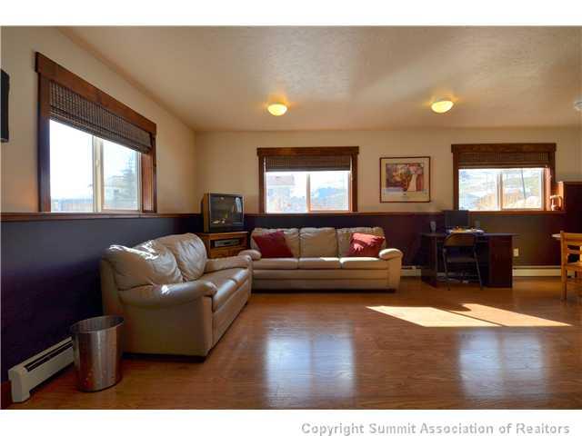414 Big Elk Road Dillon, CO 80435 - Photo 7 of 25 a living room with furniture and a large window