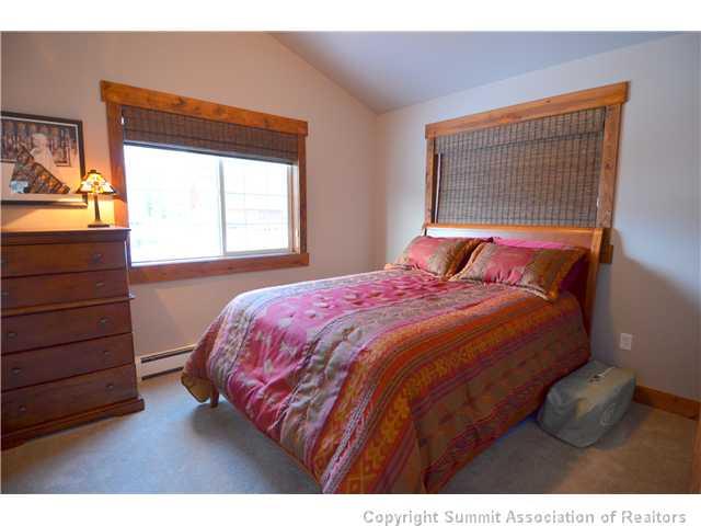 414 Big Elk Road Dillon, CO 80435 - Photo 8 of 25 a bedroom with a bed and a dresser