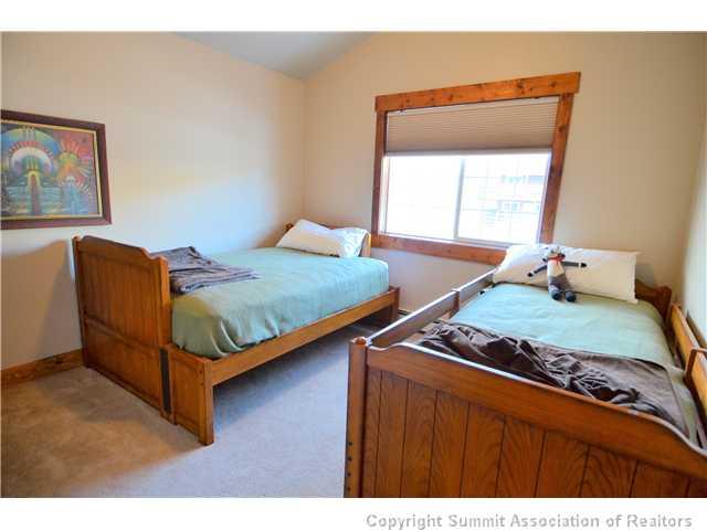 414 Big Elk Road Dillon, CO 80435 - Photo 10 of 25 a bedroom with a bed and window