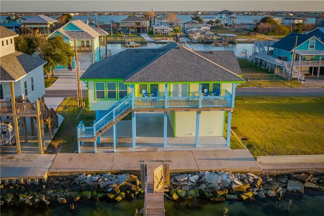 an aerial view of a house with a swimming pool