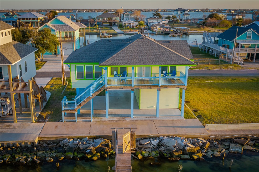 an aerial view of a house with a swimming pool