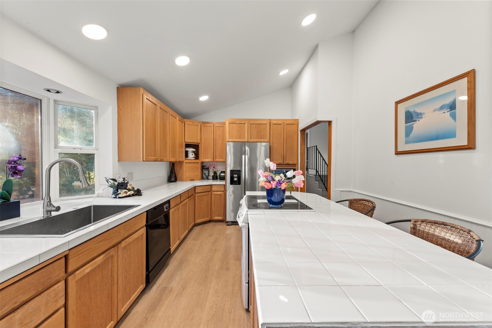 13405 Southeast 56th Place Bellevue, WA 98006 - Photo 12 of 38 a large kitchen with sink and a large counter top space