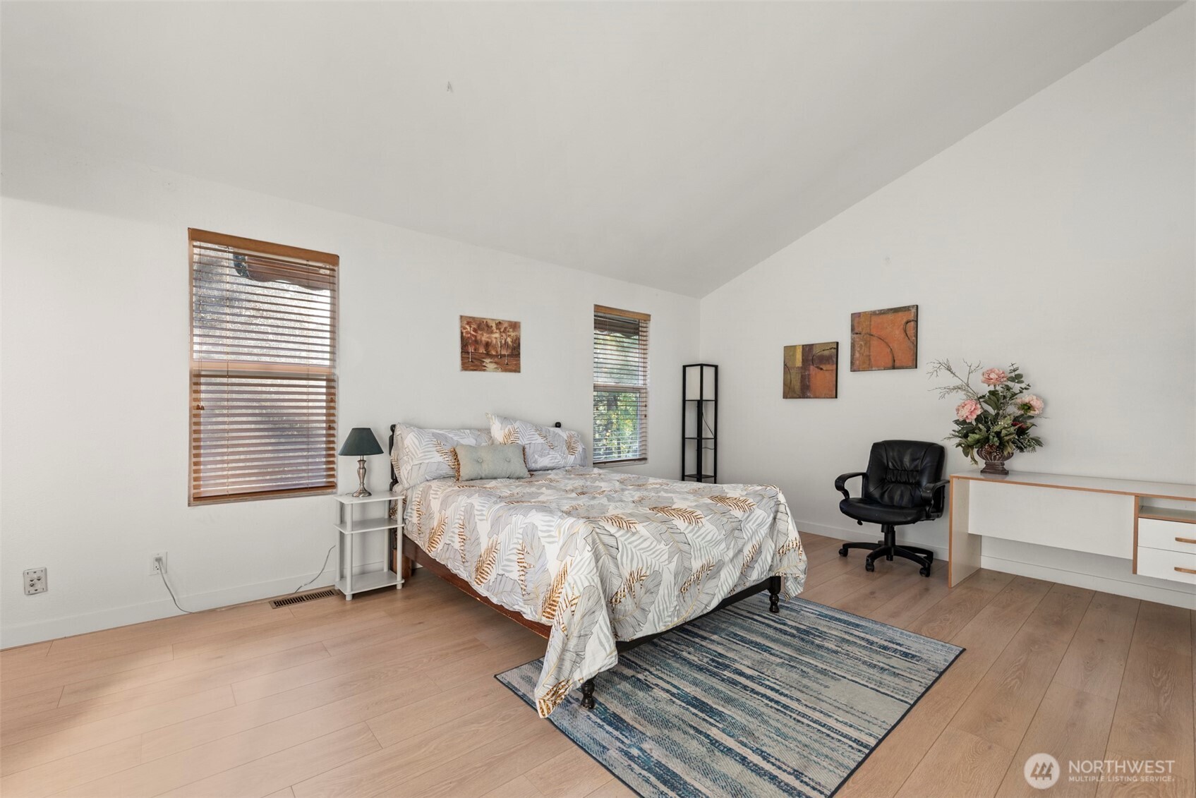 13405 Southeast 56th Place Bellevue, WA 98006 - Photo 17 of 38 a bedroom with a bed and windows