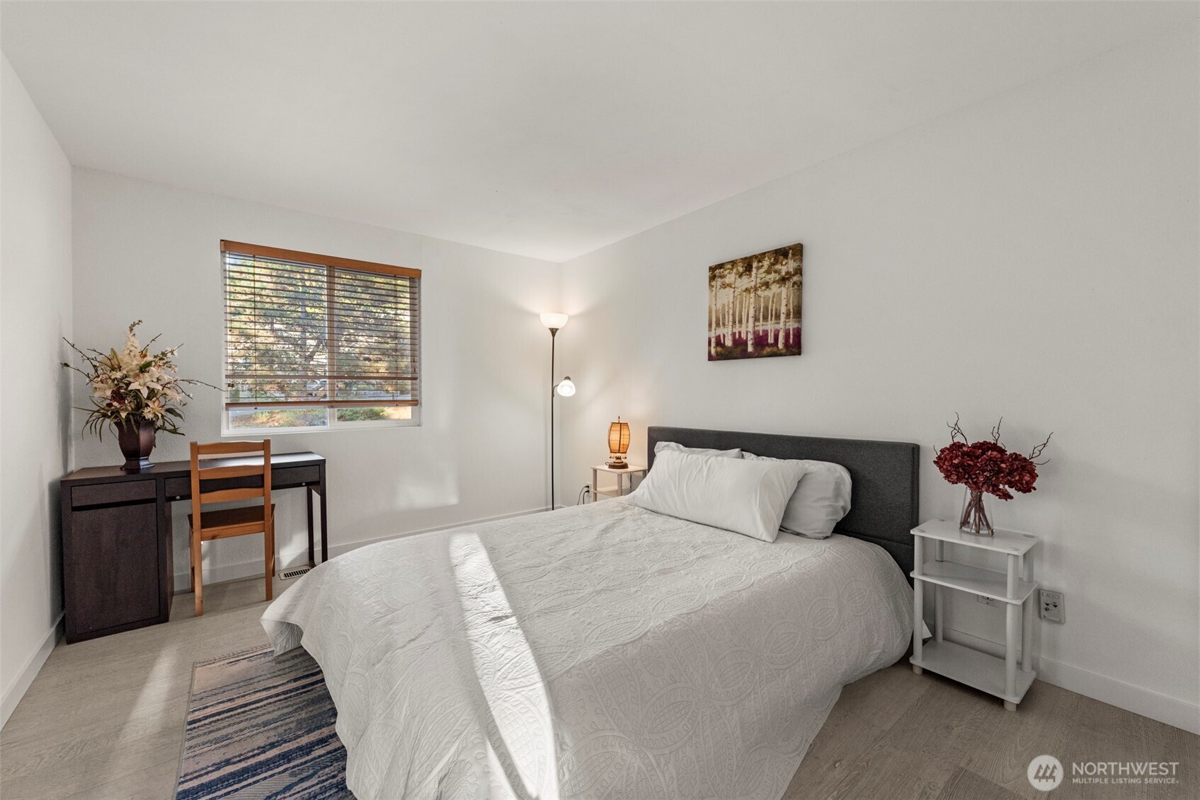 13405 Southeast 56th Place Bellevue, WA 98006 - Photo 20 of 38 a bedroom with a bed and a table