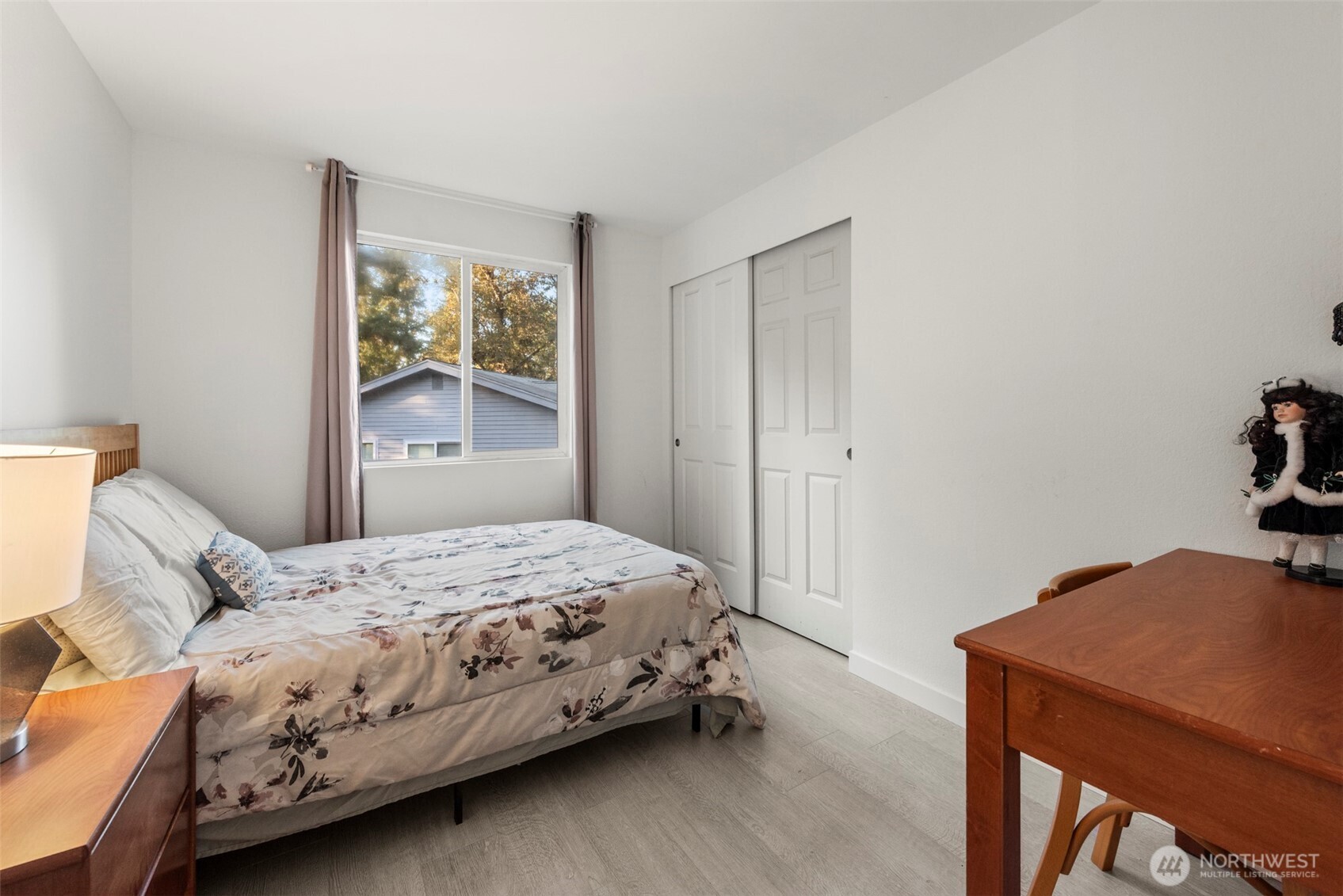 13405 Southeast 56th Place Bellevue, WA 98006 - Photo 21 of 38 a bedroom with a bed and a table in it