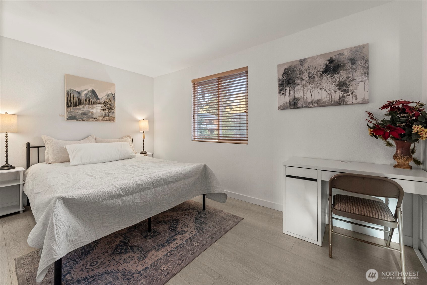 13405 Southeast 56th Place Bellevue, WA 98006 - Photo 22 of 38 a bedroom with a bed and a table in it