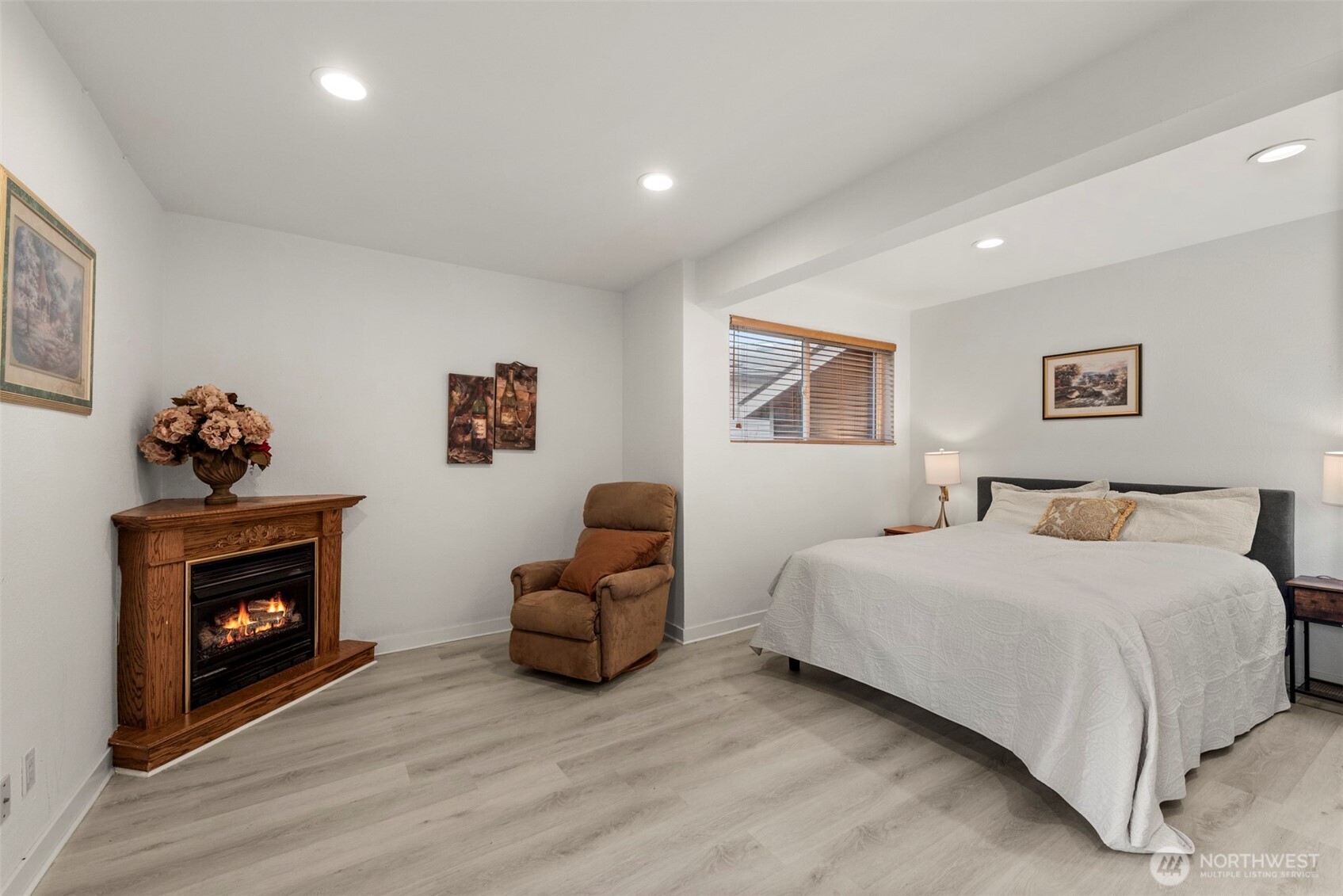 13405 Southeast 56th Place Bellevue, WA 98006 - Photo 26 of 38 a bedroom with a bed and a fireplace