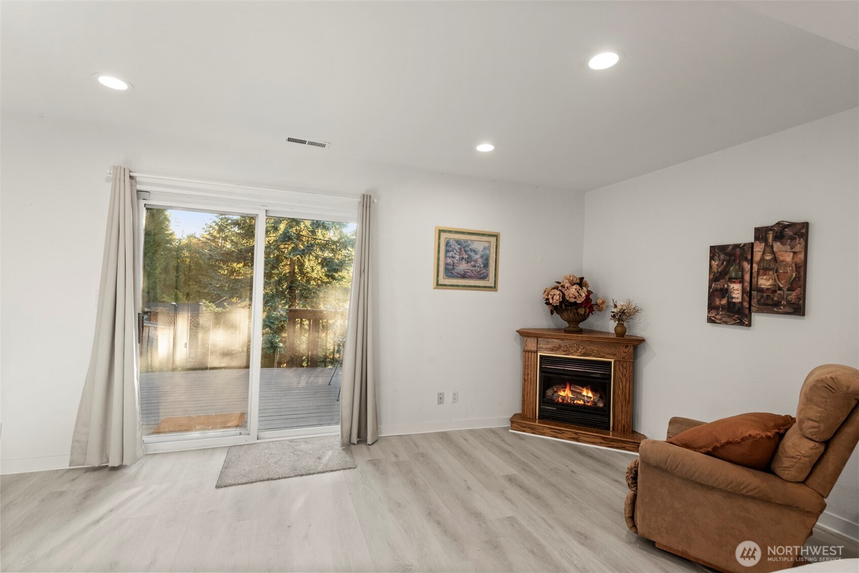 13405 Southeast 56th Place Bellevue, WA 98006 - Photo 28 of 38 a living room with furniture and a fireplace