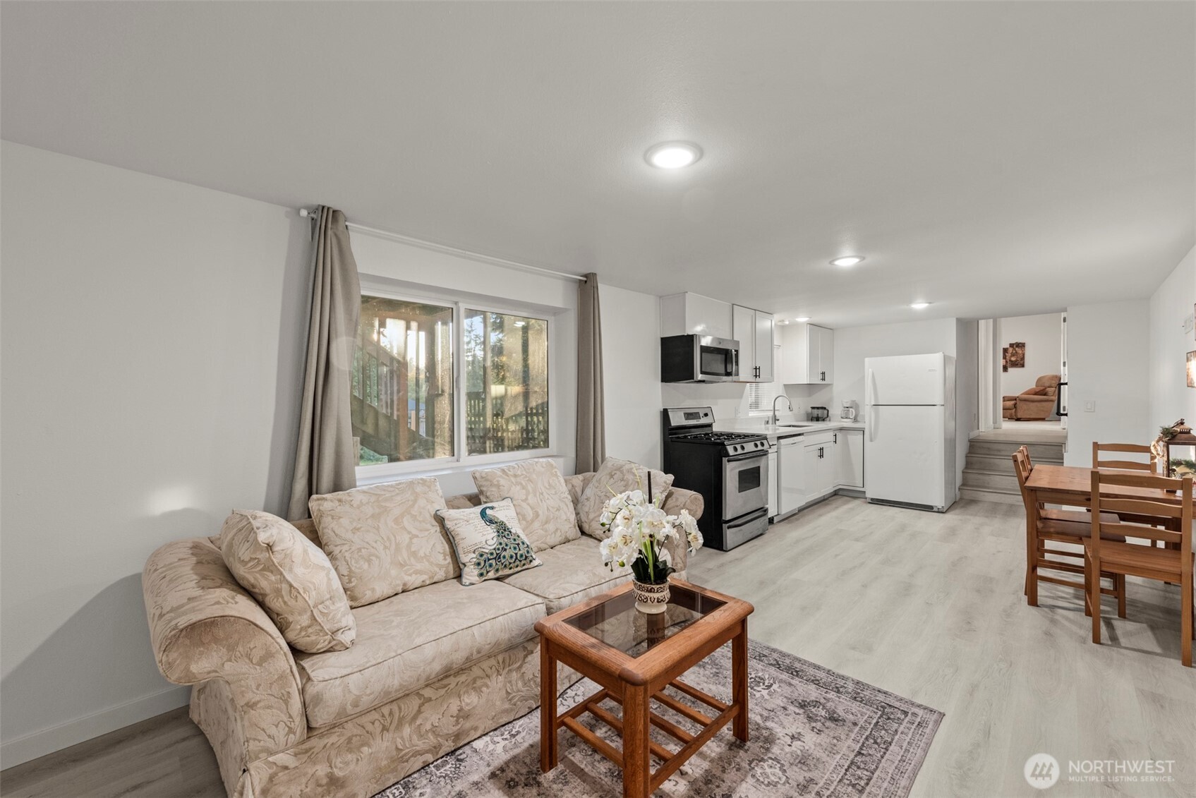 13405 Southeast 56th Place Bellevue, WA 98006 - Photo 29 of 38 a living room with furniture and kitchen view